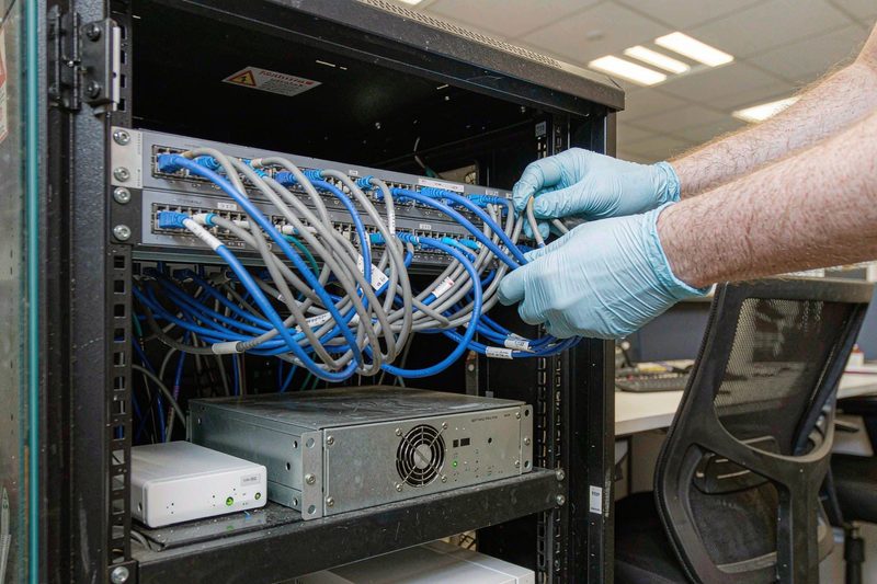 Home Fibre and ethernet patch panel in an office comms cabinet